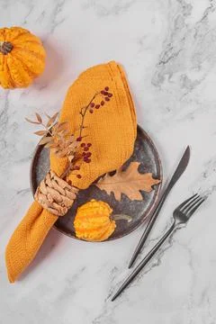 Autumn table setting with pumpkin decorations Stock Photos
