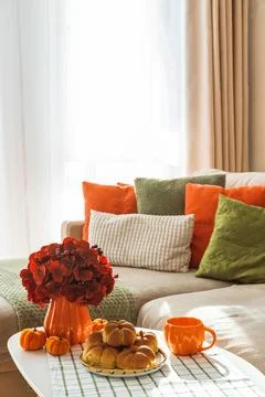 Autumn Table Setting with Pumpkin Shaped Buns with Cinnamon and Cup of Tea Stock Photos