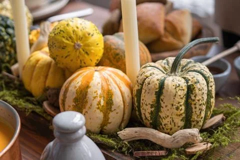 Autumn table setting with pumpkins. Thanksgiving dinner and fall decoration. Stock Photos