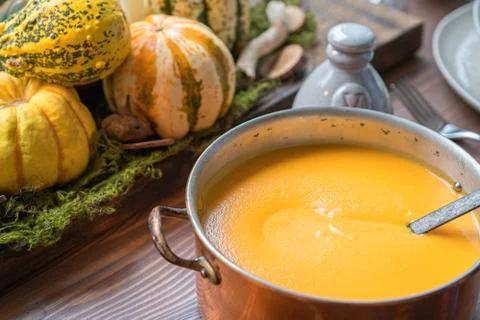 Autumn table setting with pumpkins. Thanksgiving dinner and fall decoration. Stock Photos