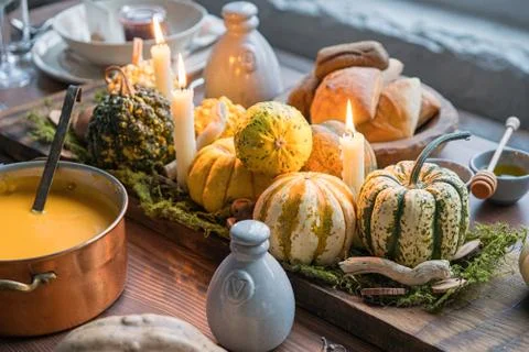 Autumn table setting with pumpkins. Thanksgiving dinner and fall decoration. Stock Photos