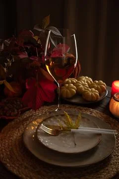 Autumn table setting welcoming Thanksgiving dinner guests Stock Photos