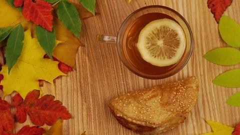 Autumn Tea with Lemon Slice and Croissant. Stock Footage 76993317