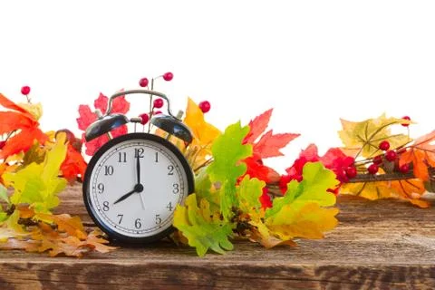 Autumn time - fall leaves with clock Stock Photos