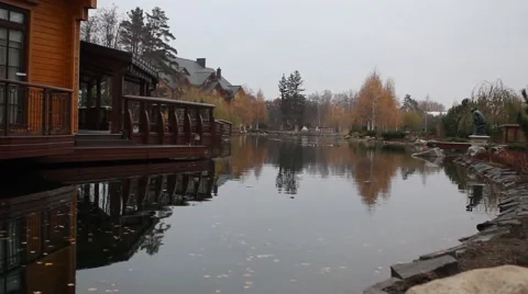 Autumn trees reflected in a quiet lake Stock Footage 48715643