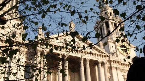 Autumn trees rustle on a tree with cathedral in the background 스톡 동영상 82788562