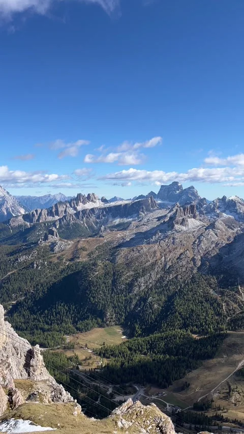 Autumn View of Lightly Snow‑Covered Peaks in the Dolomites – 4K Vertical Stock Footage 331079371