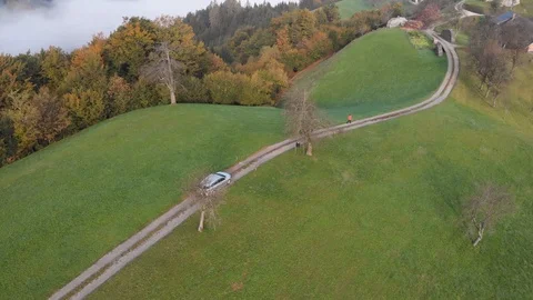 Autumn view of mountain road through the forest, in Slovenia Stock Footage 118506450