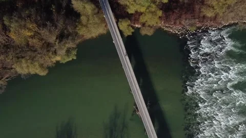 Autumn view rough river with rapids and bridge Stock Footage 142767054