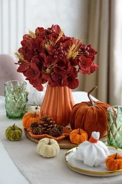 Autumnal table setting decorating dining room for holiday season Stock Photos