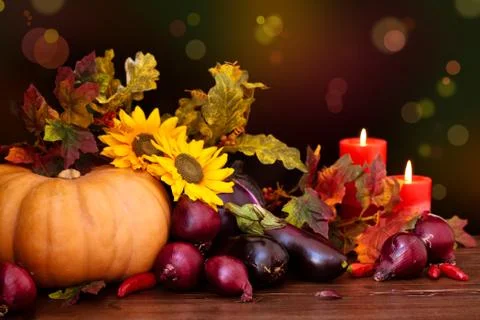 Autumnal   vegetables and candles. Stock Photos