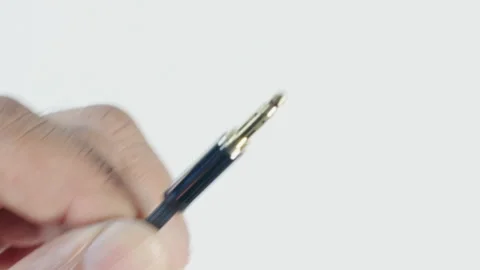 Auxillary Headphone Cable in Hand Stock-Footage 134568081