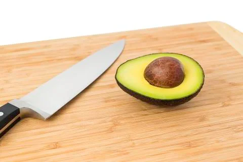 Avacado With Knife Stock Photos