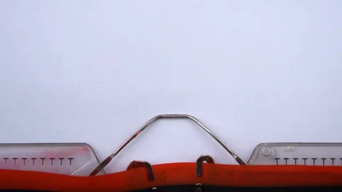 Available now - phrase printed on an old typewriter in red letters, close up. Stock Footage 126777145