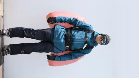 Avalanche airbag deployment on imperfect white background Stock Footage 191461690