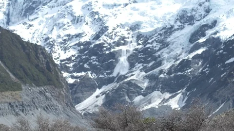 Avalanche falls down mountain side Stock Footage 110875911