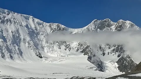 Avalanche in the mountains. A long shot. View of the Akkema wall Video stock 246292696
