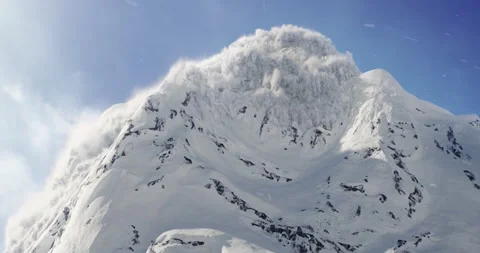 A avalanche rolling the down the mountain in The Yukon landscape in background Stock Footage
