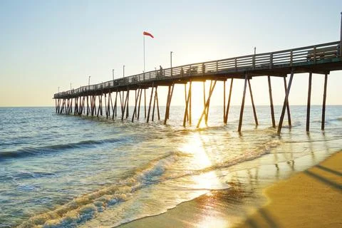 Avalon Pier and beach at the Outer Banks of North Carolina at sunrise Stock Photos