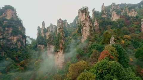 Avatar Mountain sandstone pillars with mist in China 스톡 동영상 346114974