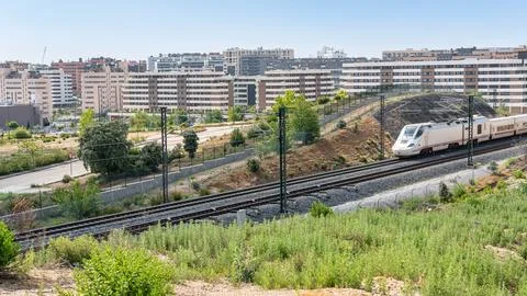 Ave high-speed train as it passes through the new neighborhoods of the city of Stock Photos