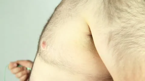 Average man measuring chest profile shot Stock Footage 11868786