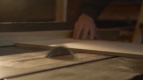 The average plan. A man sawing wood on a circular saw Stock Footage 107611842