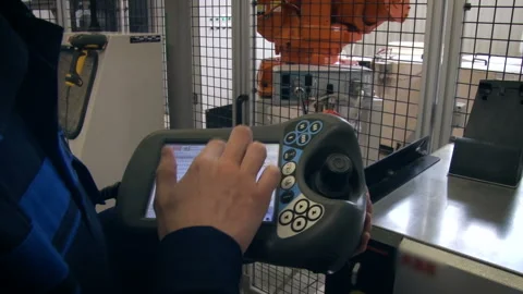 Aviation building in Perm. The worker in his hands holds the control panel for a Stock Footage 108340185