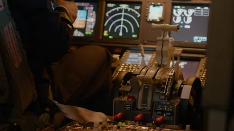 Aviation crew flying airplane with engine lever to throttle Stock Footage 202102369