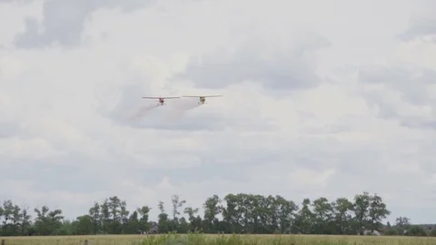 Aviation show performance on airplanes with a demonstration of aerobatics Video stock 80433350