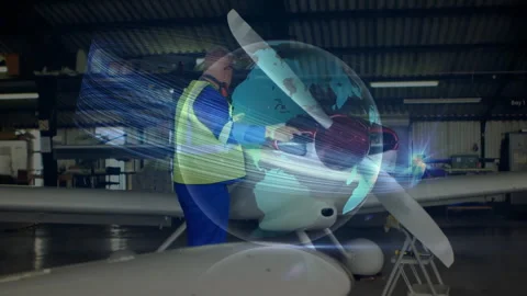 Aviation tech using torque wrench activating hologram on propeller tightening 库存影片 314473139