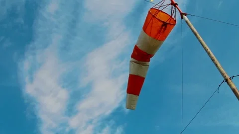 An aviation wind deflection cap flutters against a blue sky 動画素材 281940404