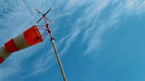 An aviation wind deflection cap flutters against a blue sky 스톡 동영상 281940738