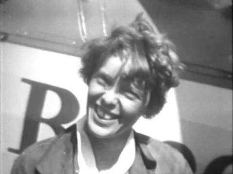 Aviator Amelia Mary Earhart takes off in an aircraft from an airfield in Canada, Stock Footage