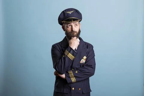 Aviator in uniform thinking about solution to make decision 库存照片