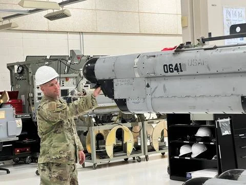 An Avionics Electronic Warfare Systems (POD) specialist assigned to the 14... Stock Photos