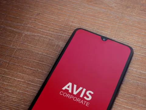 Avis Corporate app launch screen on smartphone on wooden background Stock Photos