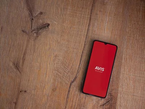 Avis IL app launch screen on smartphone on wooden background Stock Photos