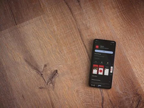 Avis IL app play store page on smartphone on wooden background Stock Photos