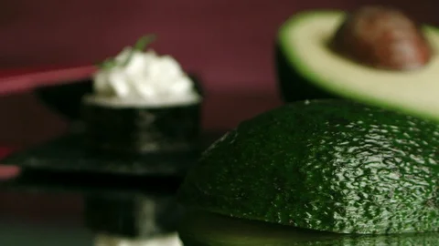 An avocado and a roll Stock Footage 102708926