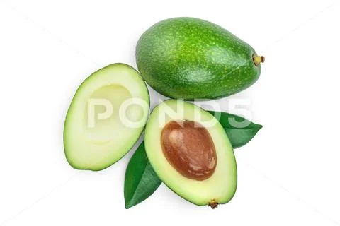 Avocado and slices decorated with green leaves isolated on white background. Top Stock Photos