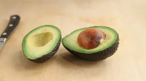 An avocado being pitted Stock Footage 24652950