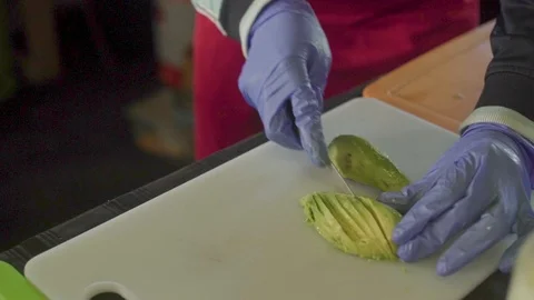 Avocado Being Sliced on a Tray Stock Footage 106557433