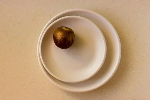 Avocado bone on beige ceramic plates Stock Photos