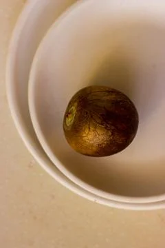 Avocado bone on beige ceramic plates Stock Photos