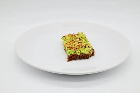 Avocado bread on a black rye bread Stock-Fotos
