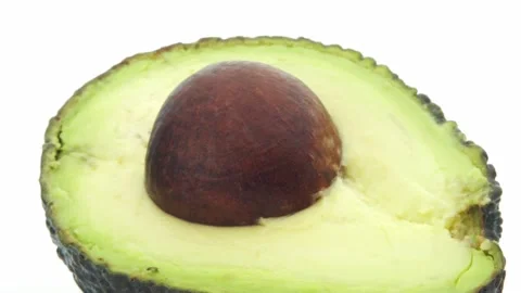 Avocado Close up of one half rotating on a turntable. Stock Footage 161104790