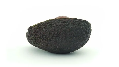 Avocado Close up of one half rotating on a turntable. Stock Footage 161104883