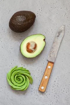 Avocado on concrete table Stock Photos