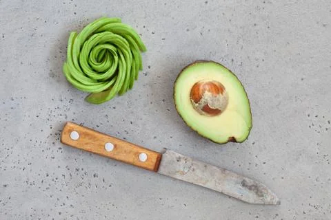Avocado on concrete table Stock Photos
